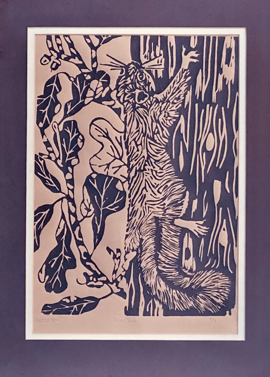 Photo of artwork created by the author, a linoleum cut print of a squirrel climbing a tree.